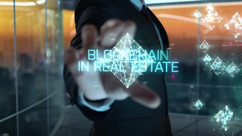 Blockchain in Real Estate chosen by businessman in technology hologram concept