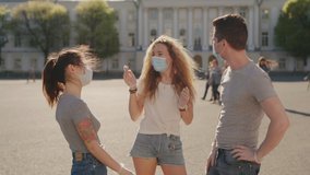 Social distancing. Multiracial Friends in protective face mask greet their elbows. Elbow bump is new greeting to avoid spread of coronavirus or covid-19 - Avoid or Stop handshakes due to pandemic - Powered by Shutterstock - Get 15% off with code: PIKWIZARD15