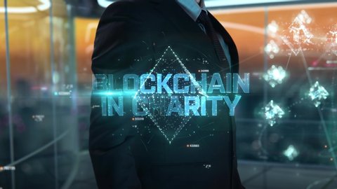 Blockchain in Charity chosen by businessman in technology hologram concept