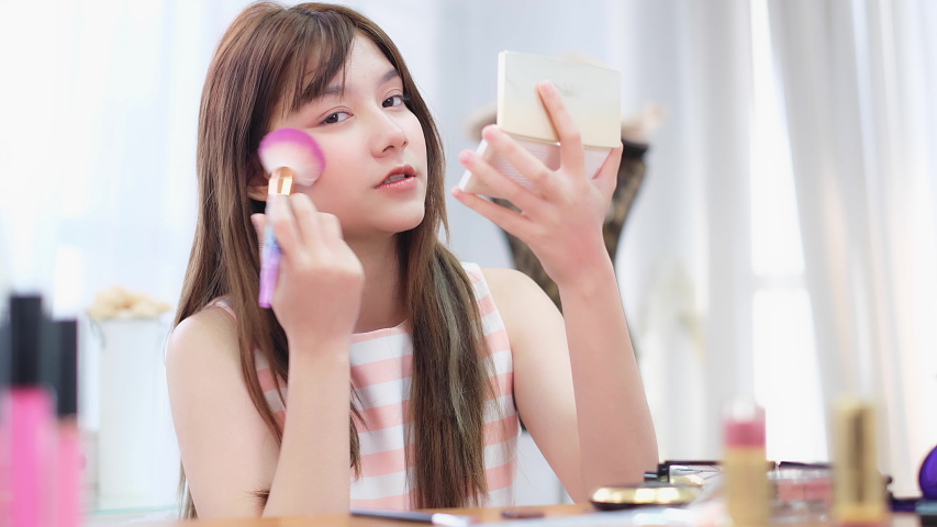 Makeup vlogger influencer creating cosmetic product explainer video. personal make up vlog.Young asian woman influencer beauty fashion blogger. Royalty-Free Stock Footage #1054728581