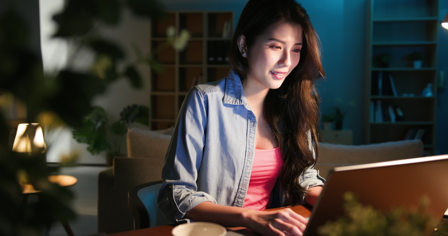 Asian business woman use computer and work from home in the evening Royalty-Free Stock Footage #1054729019