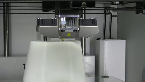 Working 3d printer, head of 3d-printer in action. 3D high tech digital printer computer machine in action. 4K.