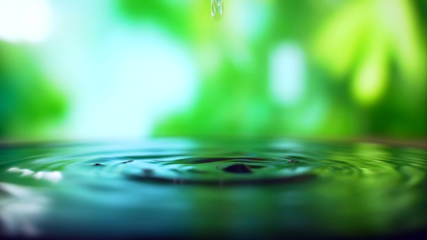 Close up. It is raining outside. Raindrops break into a puddle. water drop on nature background.	 | Shutterstock HD Video #1054730267