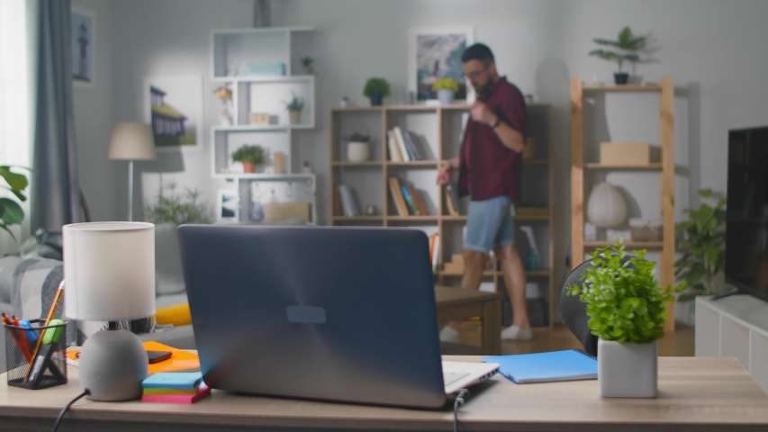 Moment of insight genial idea coming to mind of cute young man at living room