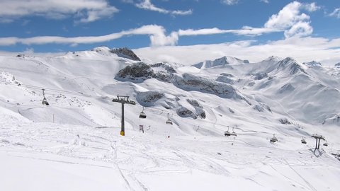 Skiresort Panorama. Endless mountain view in tyrol. Ski lift above the clouds.