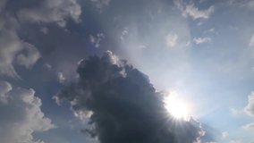 TimeLapse of beautiful sunny blue sky with bright sun light shining through white clouds & cumulus cloudscape in tropical summer or spring sunlight, sunbeam & sun ray flares at daylight sunshine day  - Powered by Shutterstock - Get 15% off with code: PIKWIZARD15