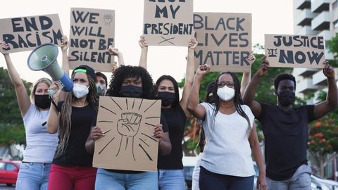 People from different culture and races protest on the street for equal rights - Demonstrators wearing face masks during black lives matter fight campaign - 4K