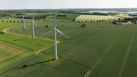 Wind turbines that produce electricity, built on a field in Skanderborg, Denmark
