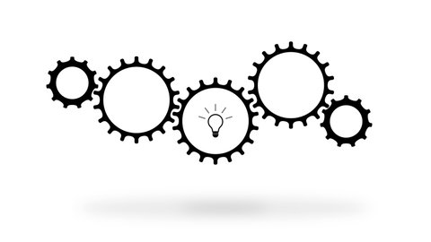 Collective idea concept. Cogwheels mechanism turning over white background while a bulb lighting up inside one of the gears.