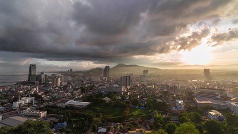 Cloudscape Time-lapse of storm clouds in the city The wind and rain are very strong, the weather is changing rapidly. The light of the sun appeared despite the dark storm clouds in the mountains.