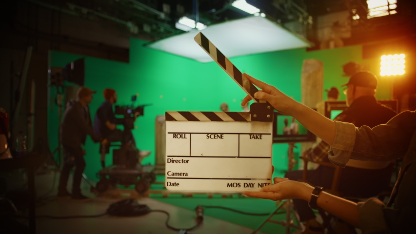 On Film Studio Set Clapperboard Shuts and Director Says "Action!", Cameraman Starts Shooting Green Screen Scene with Two Talented Actors Wearing Renaissance Clothes Talking.History Costume Drama Movie | Shutterstock HD Video #1054743548
