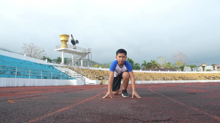 Boy Running From The Starting Point
