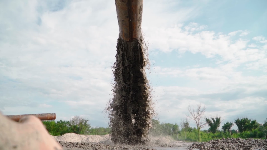 Wastewater from Large Rust Pipe Merge into Environment on the background of the Forest. Sewage from the Sewer Pollutes Terrain. Environmental Pollution. Ecological Catastrophy. Slow motion. | Shutterstock HD Video #1054755494