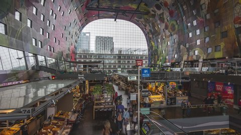 Rotterdam / Netherlands - 08 17 2017: Timelapse of people browsing inside of Markthal marketplace in Rotterdam, Holland.