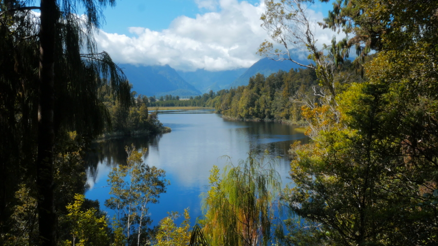 Lake Matheson is a small lake in South Westland, New Zealand, near the township of Fox Glacier. It is famous for its reflected views of Aoraki / Mount Cook and Mount Tasman, and is a traditional mahin