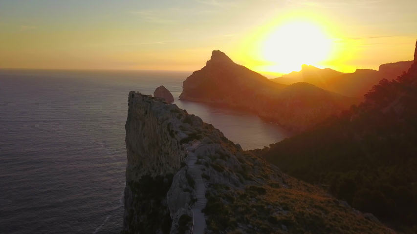 AERIAL WS Sunset over Cap de Formentor and Island of Illot el Colomer / Majorca, Spain | Shutterstock HD Video #1054763639