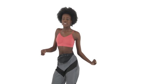Front view of young woman performing rhythmical African dance and flexible smooth buttocks movements. Twerk, booty dance concept. Isolated, on white background