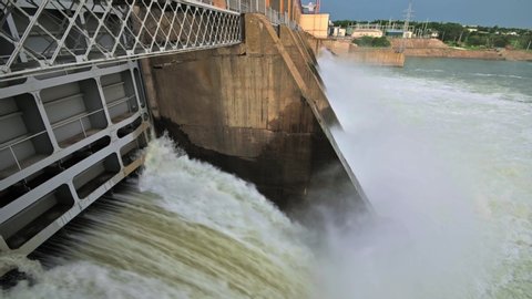 Closeup of massive discharge water from the dam of hydroelectric plant to prevent overflow