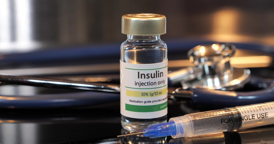 Vial of insulin injection with syringe and stethoscope Royalty-Free Stock Footage #1054773386