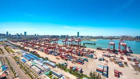 Haikou Port Container Terminal Timelapse in a Sunny Day, The Main Transportation Hub for Hainan Pilot Free Trade Zone and Free Trade Port of China, Asia.