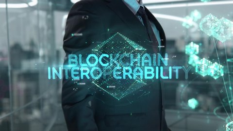 Blockchain Interoperability chosen by businessman in technology hologram concept