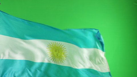 Argentina Flag flying in front of Green Screen Chroma key - Argentinian flag on Green Background. 