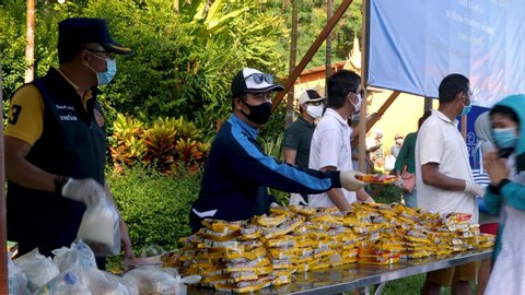 Koh Samui, Thailand - May 6, 2020: Food donations on Island during Covid-19 outbreak. Group of volunteers