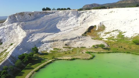 Pamukkale, meaning "cotton castle" in Turkish, is a natural site in Denizli in southwestern Turkey. The area is famous for a carbonate mineral left by the flowing water.