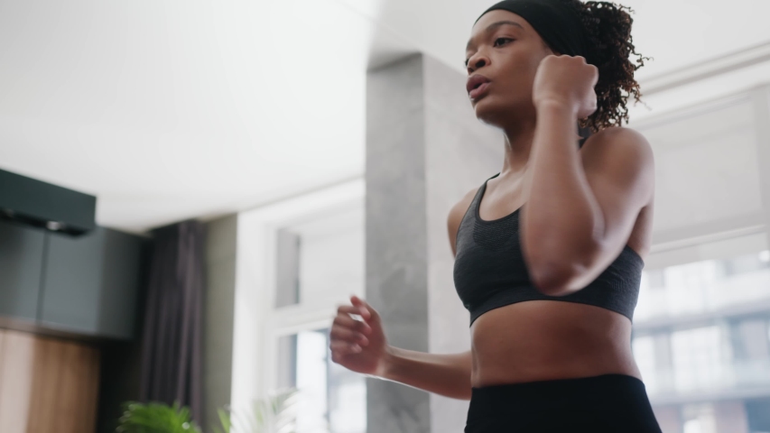 Athletic fit african american woman doing fitness exercises training full body core muscles working out at home. Self isolation. Self development. Sports and workout. Royalty-Free Stock Footage #1054807415