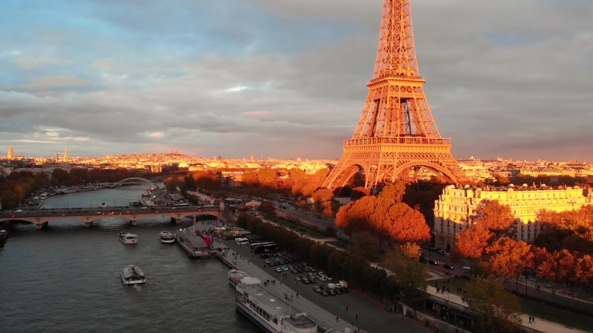 Aerial drone close up view of Paris Eiffel Tower Tour de Eiffel and panoramic view over Seine River and Paris city attractions at sunset Royalty-Free Stock Footage #1054811762