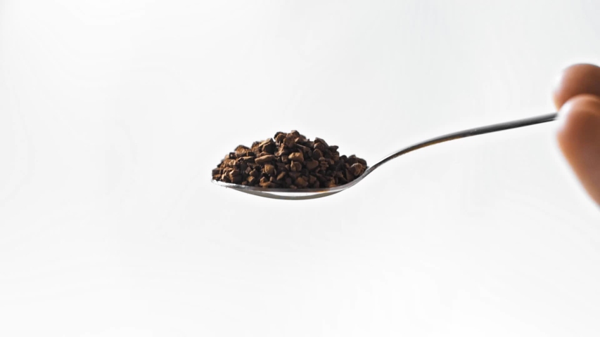 slow-motion of man holding spoon with instant coffee isolated on white Royalty-Free Stock Footage #1054813301
