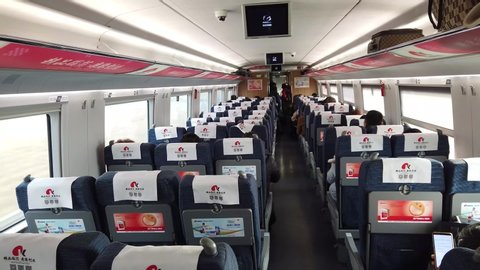 Xian, China - December 29, 2019: Inside or interior of a coach of the China railway high speed train from Xian Station to Luoyang Station with group passengers.
