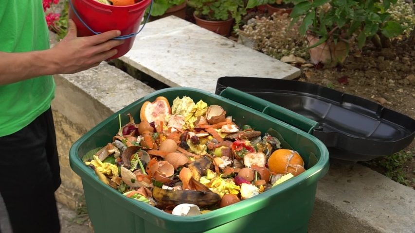 Sustainable living. Food and Green organics, recyclable materials. Bio waste bin. Kitchen food scraps including fruit, vegetables and egg shells. Separate waste collection | Shutterstock HD Video #1054823537