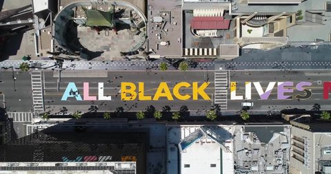 LOS ANGELES, CALIFORNIA - 2020 - high aerial over the All Black Lives Matter BLM mural on street top down Hollywood Blvd., Los Angeles, California.