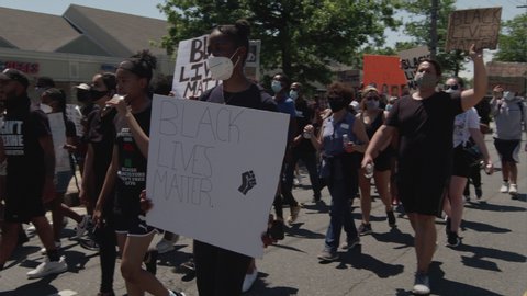 Long Island, NY / USA - June 2020: Protestors march for the Black Lives Matter movement in Long Island