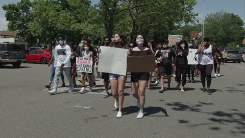 Long Island, NY / USA - June 2020: Protestors march for the Black Lives Matter movement in Long Island