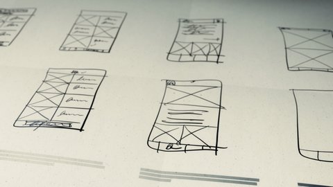App Development User Interface Wireframes Hand Drawing Animation on Paper Background