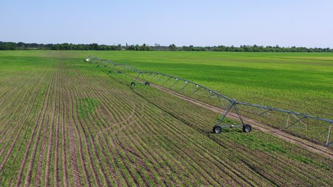 agricultural equipment for spraying fields. self-propelled sprinkler on a farm field. automatic processing of vegetables and grain with fertilizers, chemistry. new technologies for growing crops