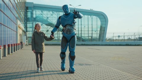 Happy child girl walking with humanoid robot cyborg talking smiling on street outdoors futuristic future machine artificial virtual intelligence innovative communication high-tech slow motion