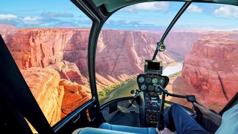Helicopter cockpit scenic flight over Horseshoe Bend of Colorado River in Arizona, United States of America. Downstream from the Glen Canyon Dam and Lake Powell.