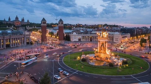 Day to night timelapse view of traffic around Plaza Espanya historical square in Barcelona, Spain.