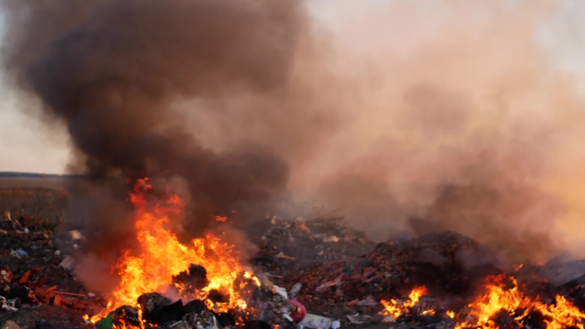 burning garbage dump. burning garbage. concern for the environment. environmental pollution. Royalty-Free Stock Footage #1054837433