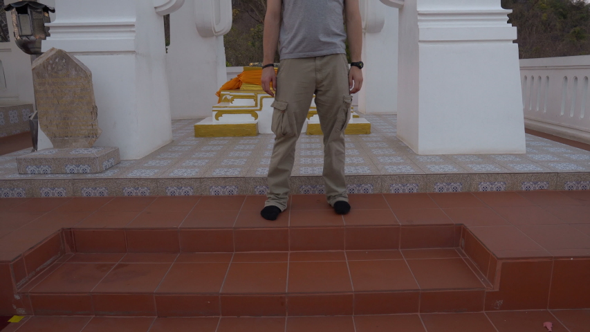 Thai Buddhist Temple on Mountain Peak - Tourist Exploring and Looking at View of Ladscape and Ocean in Distance