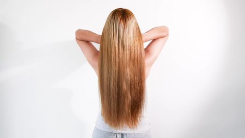 Women have shiny hair extensions.