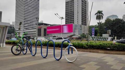 Jakarta, Indonesia - Jan 25, 2020: Parking facilities for bicycles on sidewalks Jendral Sudirman street. Jakarta's streets during the daytime. Front of Lotte Mart Ratu Plaza, Central Jakarta.