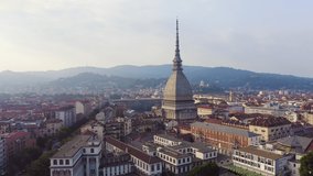 Inscription on video. Turin, Italy. Flight over the city. Mole Antonelliana - a 19th-century building with a 121 m high dome and a spire. Glitch effect text, Aerial View, Point of interest