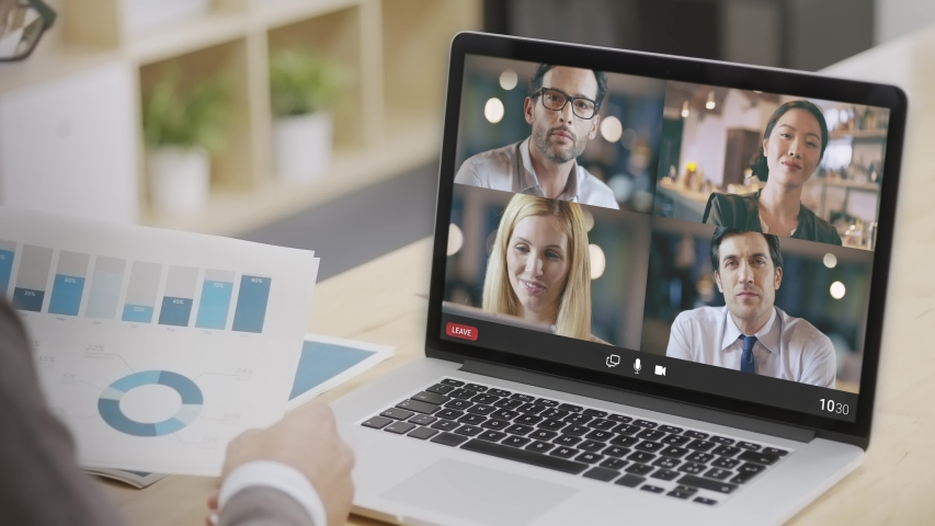 Back view of businessman video conference with colleagues from home.Business remote conference.businessman sharing screen during team video call.Charts and positive trends screen sharing | Shutterstock HD Video #1054849652