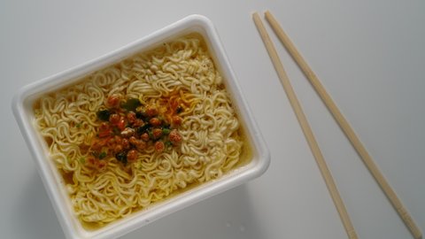 Instant noodles plate. Cooking cheap food. Stop motion.
