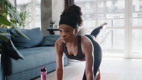 African american woman in sportswear doing workout burning fat calories training strength practicing effort domestic fitness females aerobics sport fit at home slow motion - Powered by Shutterstock - Get 15% off with code: PIKWIZARD15