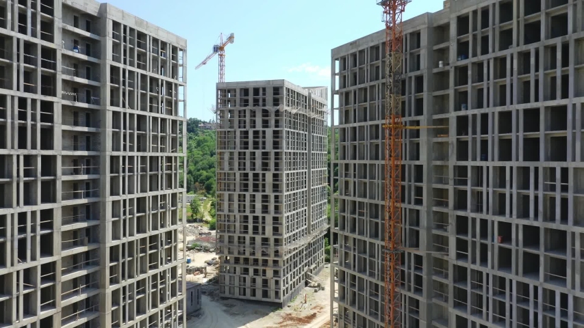 Construction of a multi-storey apartment building. Aerial video. Quadcopter. Drone. Multi-quarter house Royalty-Free Stock Footage #1054864889